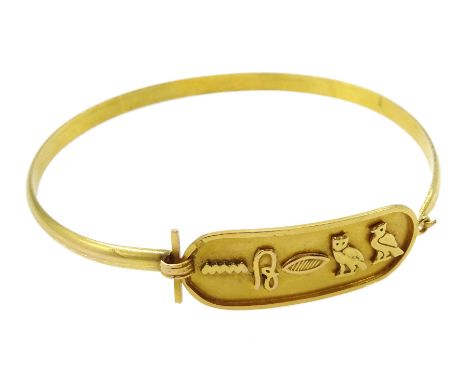 Egyptian gold bangle with hieroglyph decorationClick here to view further images, condition reports, sale times &amp; deliver