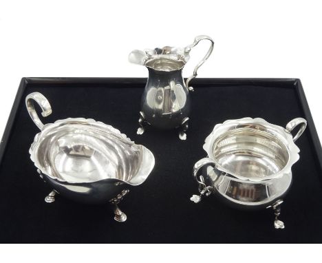 Silver milk jug and sugar bowl by Robert Pringle &amp; Sons, London 1919 and a silver sauce boat by Sheffield Harrison Brothe