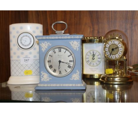 A WEDGEWOOD JASPERWARE MANTLE CLOCK PLUS ANOTHER WEDGEWOOD CLOCK AND TWO OTHERS
