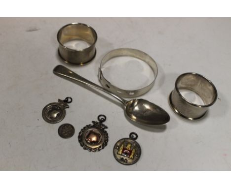 A SELECTION OF HALLMARKED SILVER ITEMS TO INCLUDE NAPKIN RINGS, BANGLE, TEASPOON, FOBS ETC.