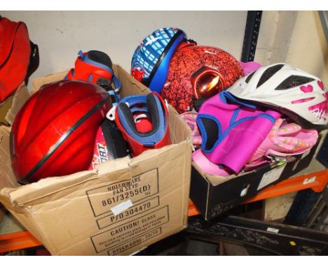 TWO TRAYS OF CHILDS ROLLER SKATES, HELMETS ETC