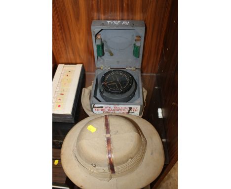 A 1940'S ERA WOODEN CASED COMPASS TOGETHER WITH A VINTAGE PITH STYLE HAT 