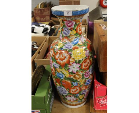 A LARGE FLORAL CERAMIC VASE