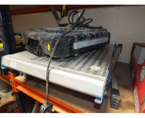 A WET TILE SAW TOGETHER WITH A FOLD UP STAND
