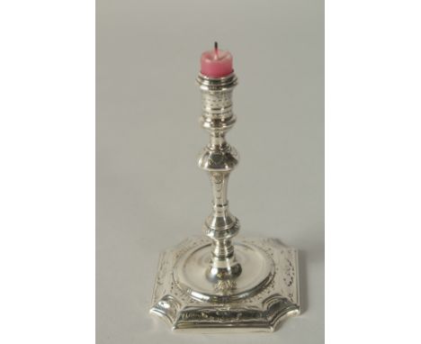 A GEORGE II SLVER TAPER STICK. London 1727,  maker: James Gould. 12ins high.