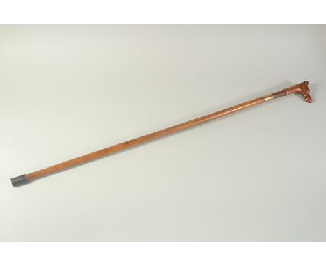 A GOOD 18TH CENTURY WOODEN CASED SWORD STICK with carved dog handle. 3ft long.