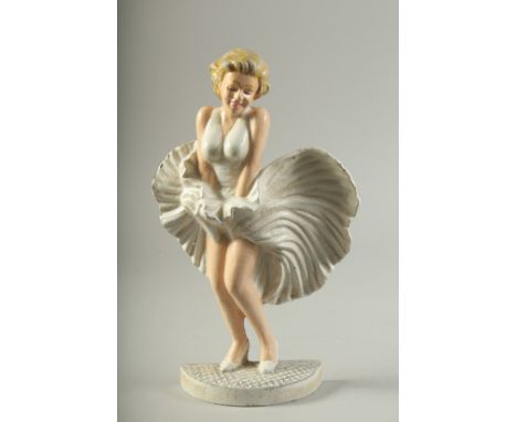 A CAST IRON PAINTED MARILYN MONROE. 13ins high.