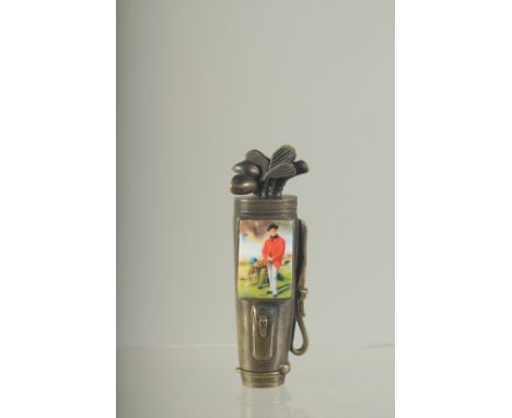 A BRASS AND ENAMEL GOLF BAG VESTA. 8cms long.