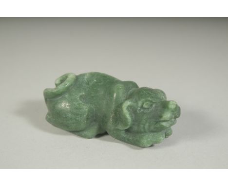 A CARVED JADE PIG, 2.75ins long.