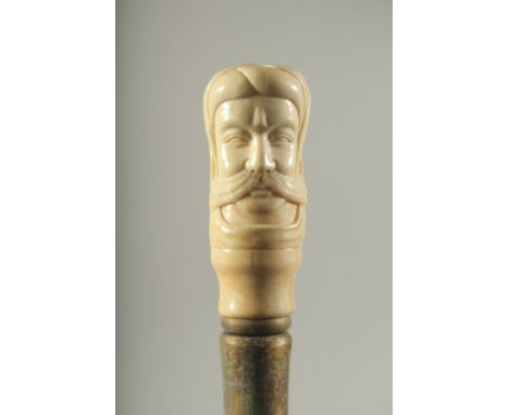 A WALKING STICK WITH CARVED BONE HANDLE "TURK".