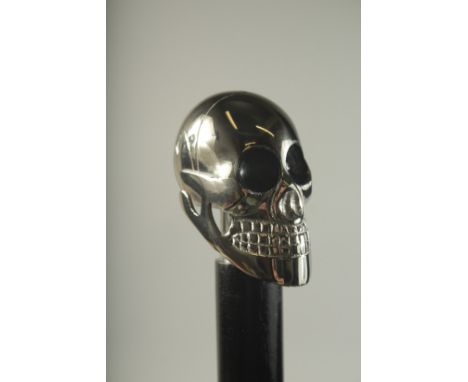 A WALKING STICK WITH CHROME HANDLE "SKULL".
