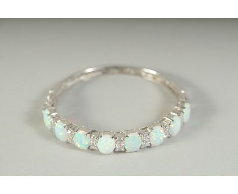 A GOOD SILVER OPAL SET BANGLE, boxed.