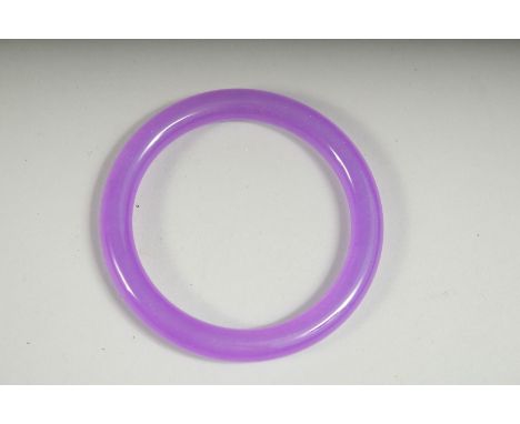 A LAVENDER JADE BANGLE, 2.75ins diameter.