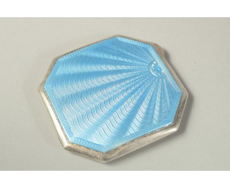 AN ENGINE TURNED BLUE ENAMEL COMPACT.