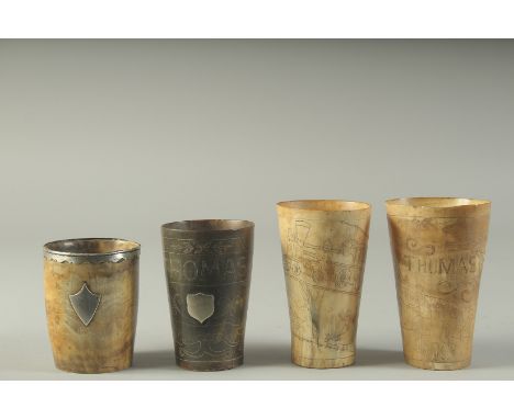 FOUR ENGRAVED HORN BEAKERS. 4.75, 4.5, 4 &amp; 3.5ins. Etched THOMAS with animals, THOMAS with a tree, Steam Engine and verse