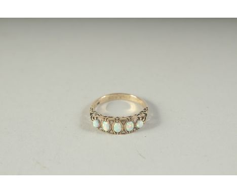 A 9CT GOLD, OPAL AND DIAMOND RING, boxed.