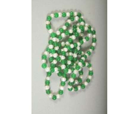 A STRING OF PEARLS AND JADE. 48ins long.