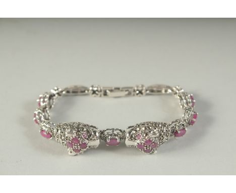 A SILVER RUBY AND MARCASITE PANTHER BRACELET, boxed.