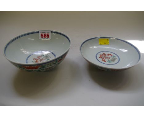 A Chinese doucai bowl and cover, seal marks, painted with bats above a band of flowers and a further band of waves, 14.5cm di