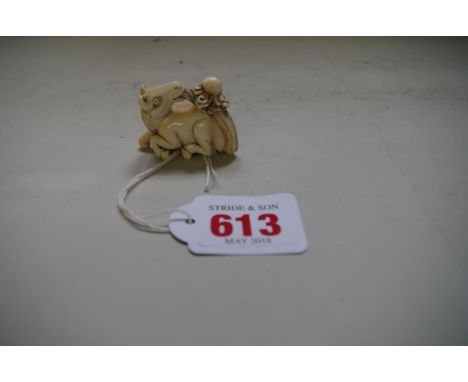 A Japanese carved ivory netsuke of a horse, indistinctly signed, 4.6cm long. 