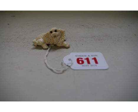 A Japanese carved ivory netsuke of a qilin,&nbsp;signed,&nbsp;5cm long. 