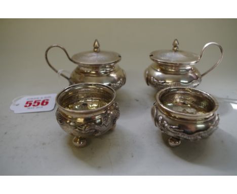A Chinese silver four piece cruet set, by CS, late 19th century, engraved and applied with dragons,&nbsp;196g. 