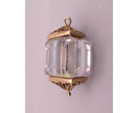 A 9 ct gold and crystal lantern design charm. 2.5 cm high. 8.2 grammes total weight.