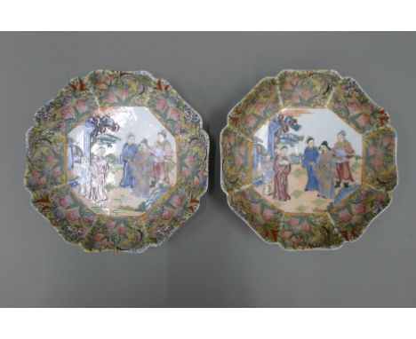 Two Chinese famille rose wall plates, with six character seal mark to base. 21.5 cm diameter.