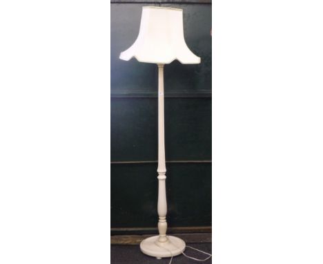 A white painted standard lamp. 