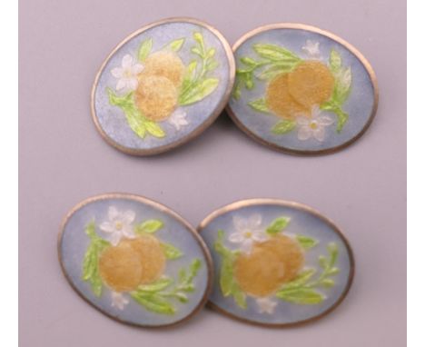 A pair of silver enamel cufflinks.  1.75 cm wide.