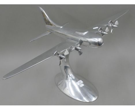 A large aluminium model of a four engine bomber plane. 80 cm wide.