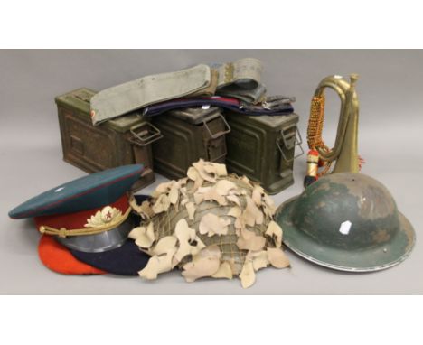 A quantity of various militaria, including helmets, belts, ammunition boxes, etc.