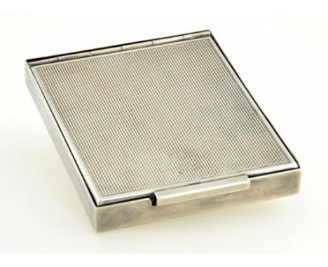 A SILVER COMPACT, ENGINE TURNED, 7CM W, CIRCA 1940