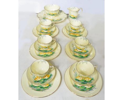 A CROWN STAFFORDSHIRE BONE CHINA YELLOW GROUND TEA SERVICE, DECORATED WITH YELLOW WATER LILIES, 1930'S 