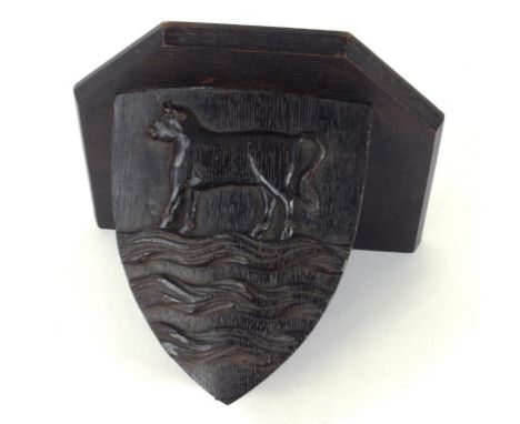 A CARVED OAK WALL BRACKET