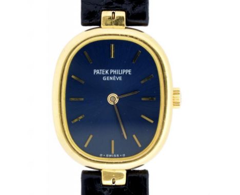 A PATEK PHILIPPE 18CT GOLD ELIPSE WRISTWATCH, WITH BLUE DIAL, PATEK PHILIPPE BLACK LEATHER STRAP AND 18CT GOLD BUCKLE