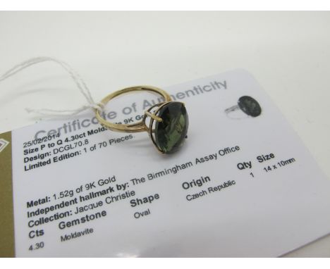 A Modern 9ct Gold Moldavite Single Stone Dress Ring, oval four claw set high between plain shoulders (finger size P1/2). *Gem