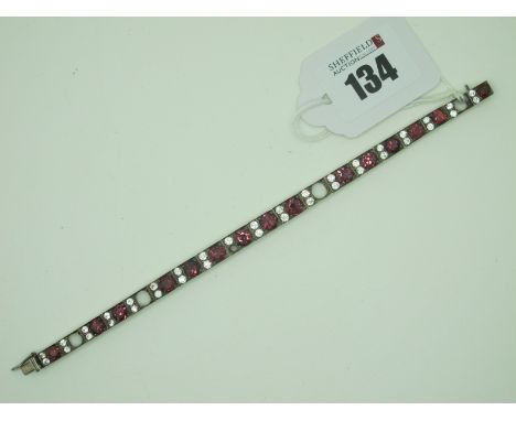 A Vintage Line Bracelet, the hinged rectangular panels alternately set (five stones missing), to snap clasp, 18cm long.