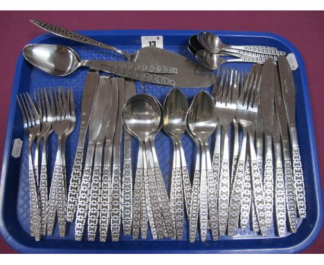 A Retro Six Setting Canteen of Stainless Steel Cutlery, (stamped "Korea") including two serving spoons and a cake slice :- On