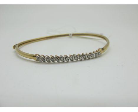A Modern Diamond Set Bangle, illusion set to the front, stamped "9k" (4.5grams). 