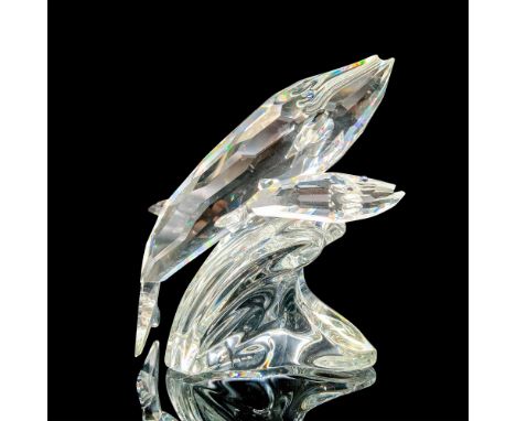 Depicts two crystal whales with blue eyes, an adult and child riding on a wave. Swarovski SCS backstamp. This item has its or
