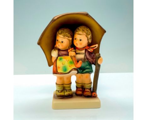 A figure of two school children sharing a yellow umbrella to stay safe from rain. Goebel Hummel backstamp. Certificate of Aut