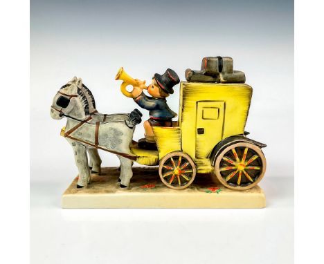 Hand painted in matte finish modeled as a horse-drawn carriage with lad blowing a horn to announce his arrival with the mail.