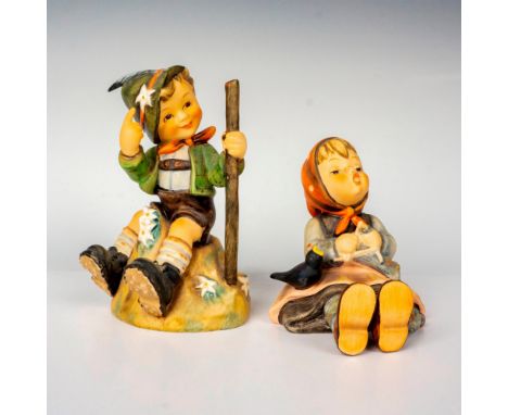Hand painted in matte finish modeled as a young boy sitting on a rock and a young girl sitting with bird perched on lap. M. I