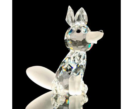 Sparkling faceted and molded crystal figurine modeled as a seated fox with black facial features and frosted tail. Swarovski 