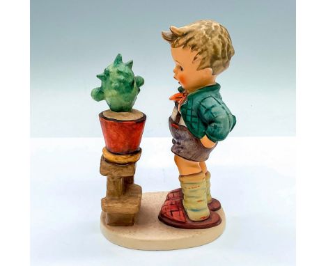 Hand painted figure of a young boy looking at a cactus. Goebel Hummel backstamp. Issued: c. 1979-1990Dimensions: 4"L x 2.75"W