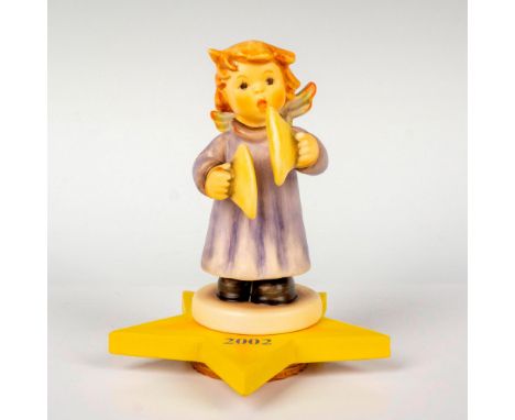 Annual edition, hand painted in matte finish and is displayed on its star shaped base. M. I. Hummel impressed backstamp. Goeb