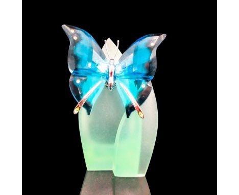 Figurine on green frosted stand. This item has its original box:4.25"L x 4.25"W x 2.25"H. Dimensions: 2.5"L x 1.25"W x 3.5"HM