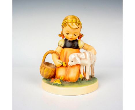 Hand painted in matte finish modeled as a young girl playing with her lamb. M. I. Hummel impressed backstamp. Goebel backstam