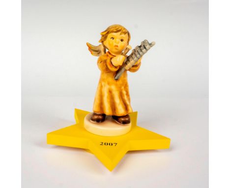 Annual edition, hand painted in matte finish and is displayed on its star shaped base. M. I. Hummel impressed backstamp. Goeb